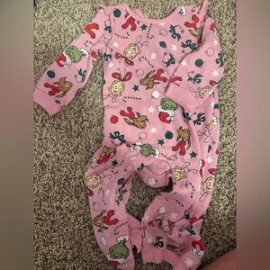 Grinch pink one piece pajamas with snap closure on legs